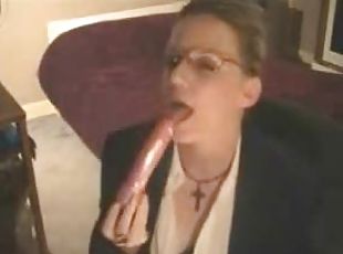 Business babe sucks pink dildo