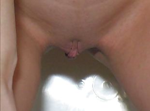 Redhead with shaved pussy goes pee