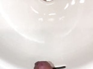 Naughty Pissing and Cumming in my bathroom sink featuring a bullseye cumshot into the drain