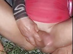 A quick cumshot outside on a warm windy night in my backyard with the grass tickling my hole