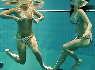 Two sexy amateurs showing off their bodies underwater