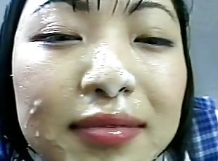 Young japanese gets covered in jizz