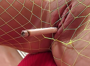 Blonde in fishnets is working her pussy