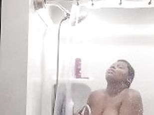 Using the showerhead to cum trying not to scream